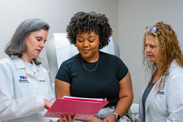 Heather Wright, MD, breast surgical oncologist consults with a patient