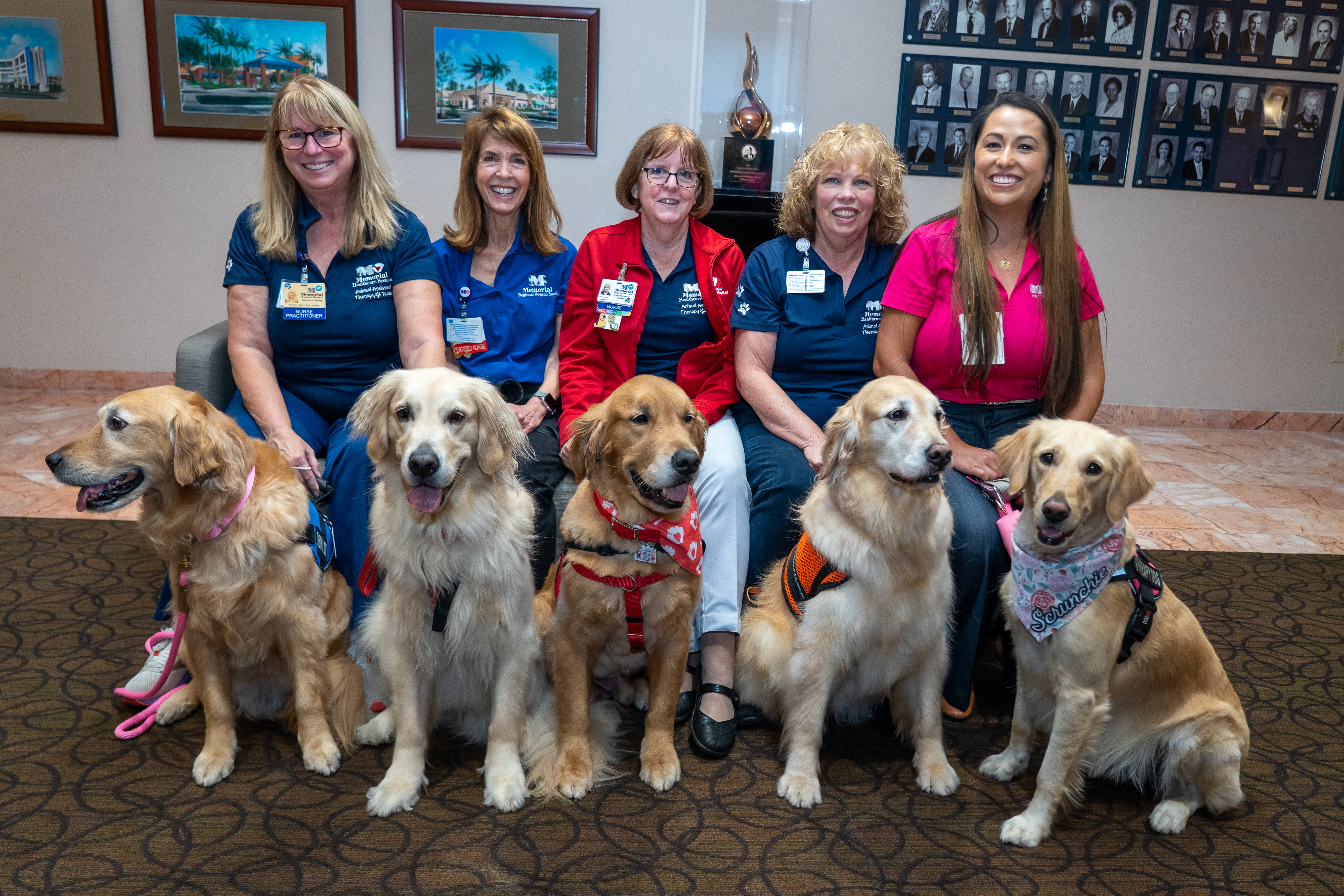 Group of therapy dogs with handlers