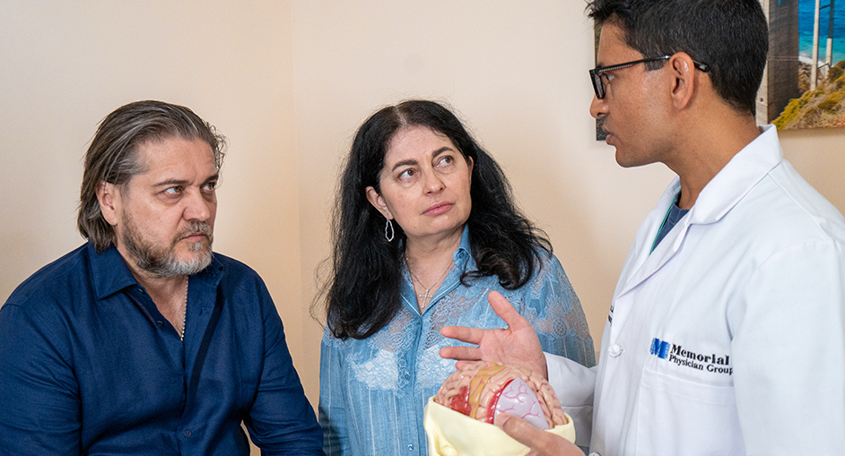 Physician, talking to patient and wife