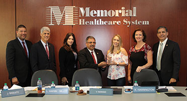 commissioners presenting monthly employee award