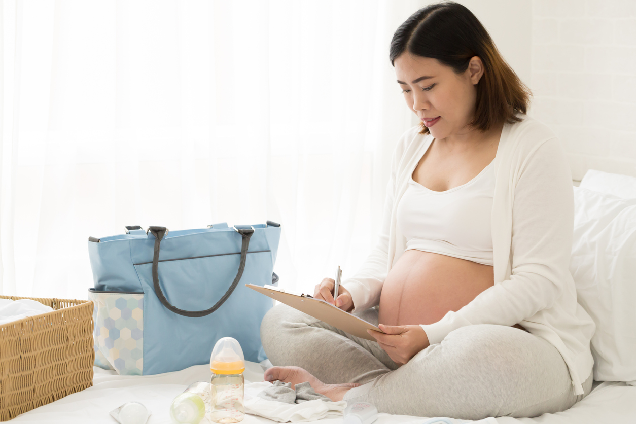 pregnant woman preparing birth bag