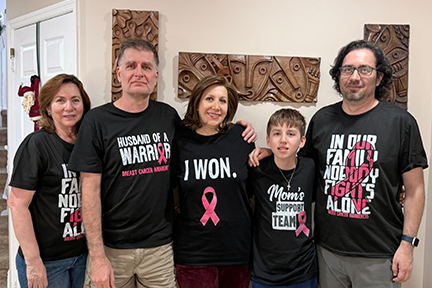 Patricia and her family wearing cancer survivor tees