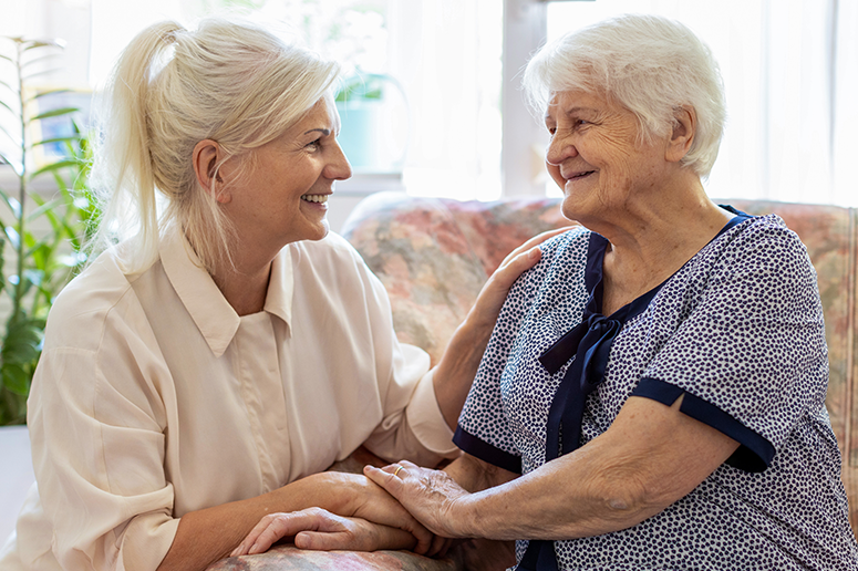 woman comforting elderly mom