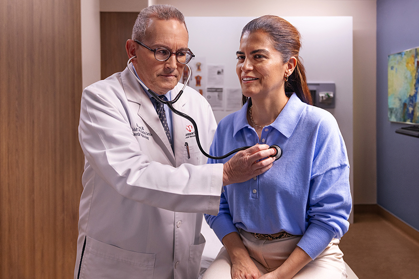Doctor examining the patient by using stethoscope on a patient