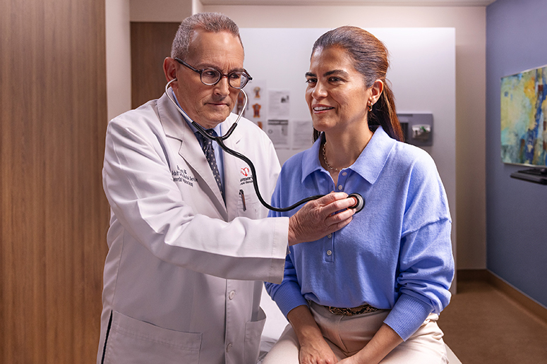 Doctor examining the patient by using stethoscope on a patient