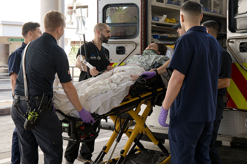 Patient being transferred by ambulance
