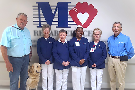 Volunteers and pet therapy dog at Memorial Regional Hospital