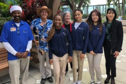 Teens volunteers at Memorial Cancer Institute's rooftop garden during holidays