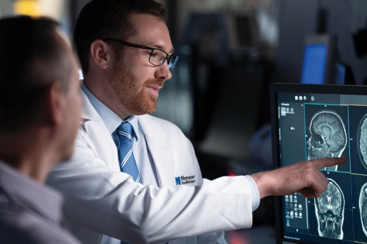 Doctor with patient examining imaging results