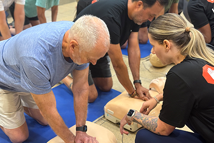 Participants and trainer at CPR workshop