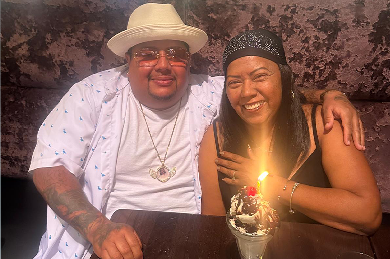 Yolanda Ortiz with son celebrating her birthday