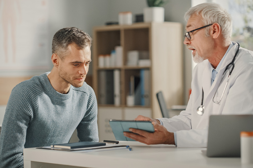 A man discusses his health with a doctor