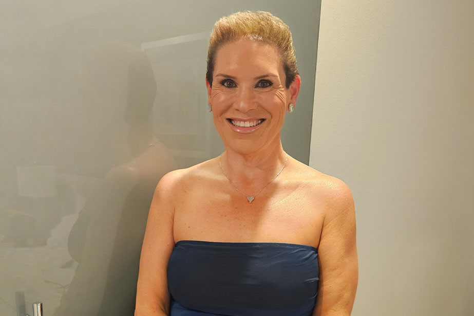 Lori smiling for photo