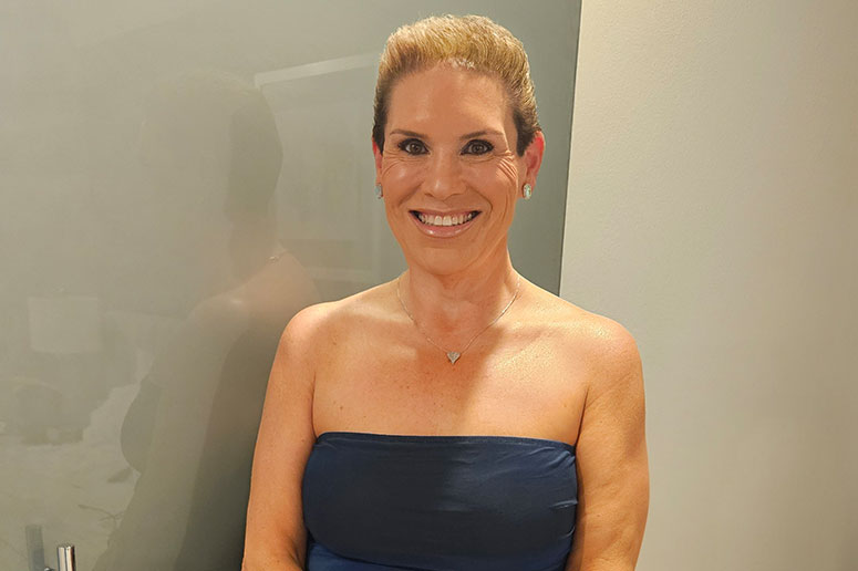 Lori smiling for photo