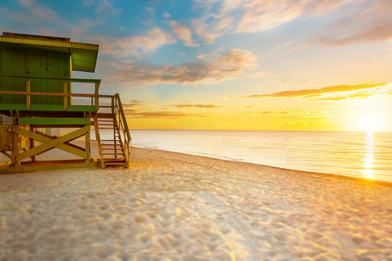 beach sunrise green lifeguard building