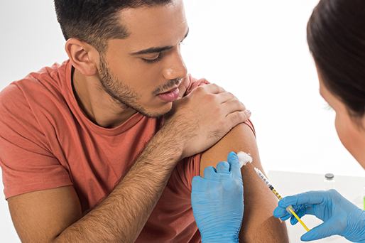 man receiving vaccine in arm
