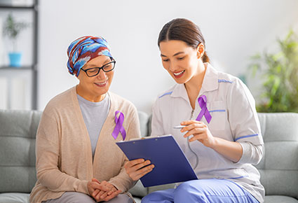 Cancer patient with support services team member