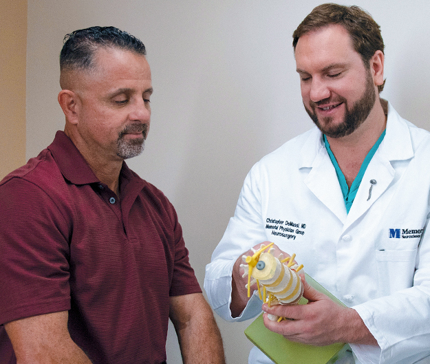 Anthony, who had a herniated disk, and Christopher DeMassi, MD, Chief, Neuroscience Institute, Chief, Adult Neurosurgery, and Medical Director, Spine Center, Memorial Neuroscience Institute